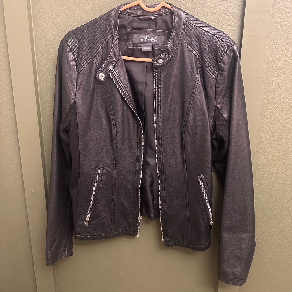 Kenneth Cole leather jacket. Lightly worn on the back collar.
